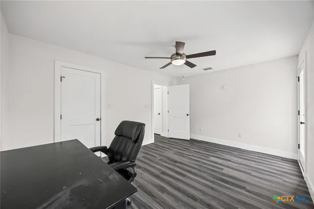 a view of a livingroom with furniture and wooden floor