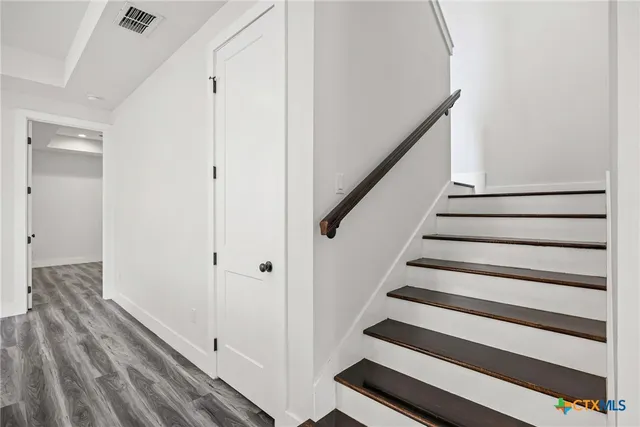 a view of entryway with wooden floor