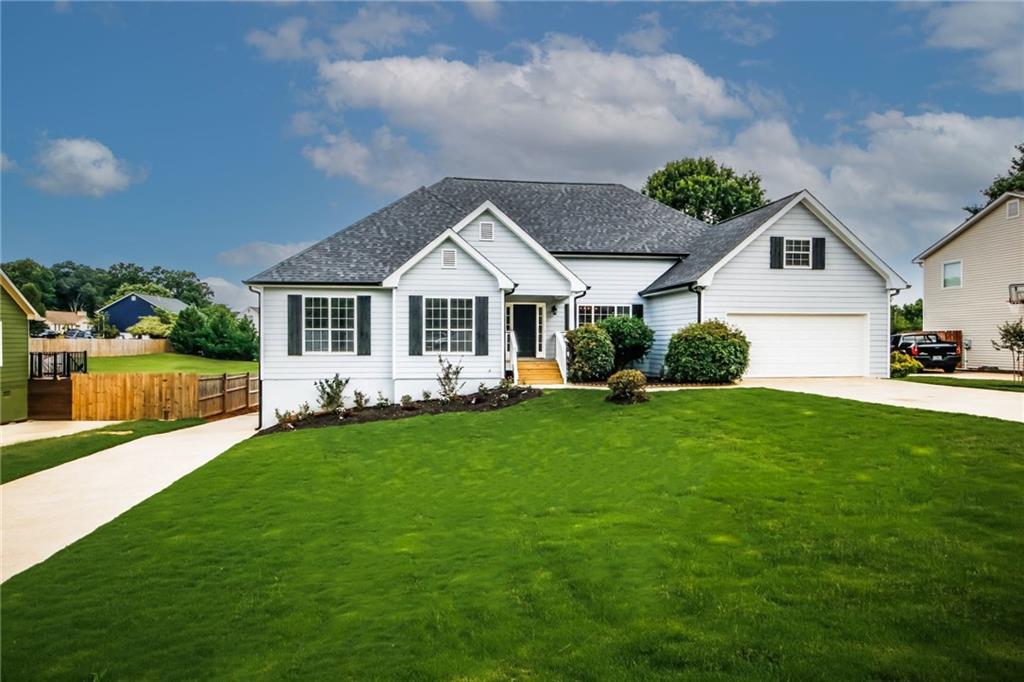 a front view of a house with a yard