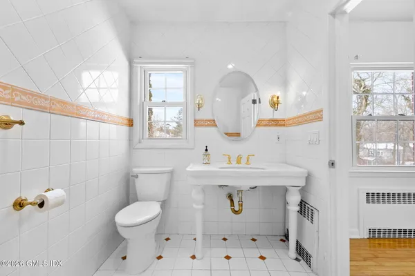 a bathroom with a shower and a glass door