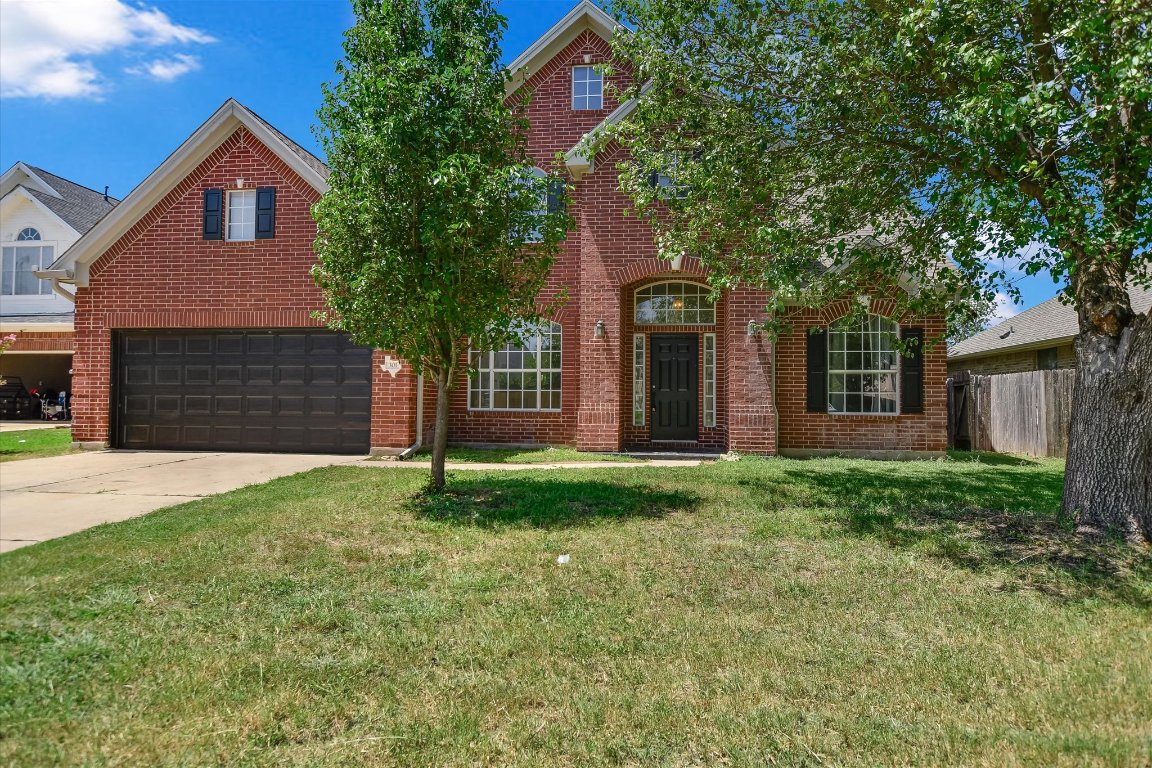 301 Gulfstream Drive Georgetown, TX 78626 - Photo 1 of 35 a front view of a house with a yard and garage