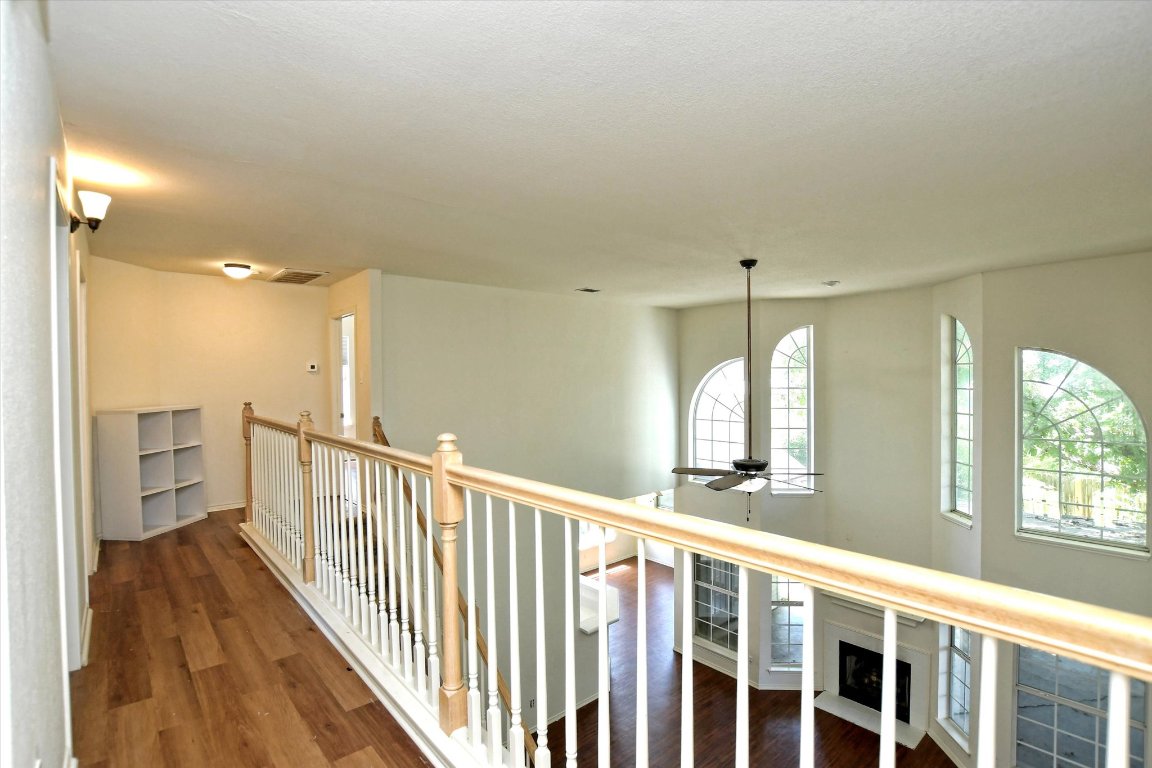 301 Gulfstream Drive Georgetown, TX 78626 - Photo 21 of 35 a view of a hallway with wooden floor and windows