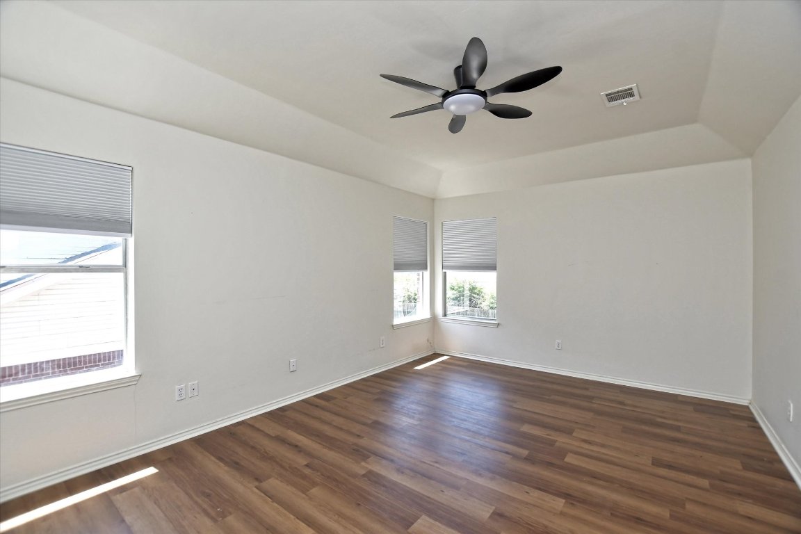 301 Gulfstream Drive Georgetown, TX 78626 - Photo 22 of 35 a view of a big room with wooden floor and windows