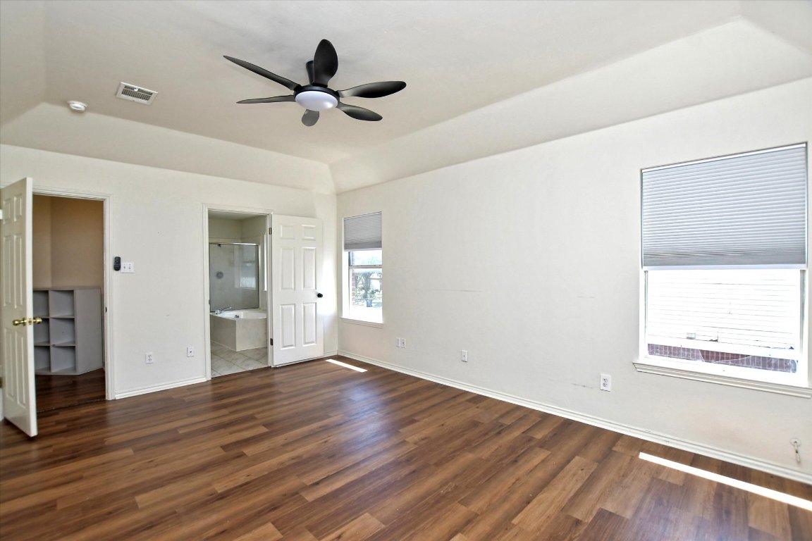 301 Gulfstream Drive Georgetown, TX 78626 - Photo 23 of 35 wooden floor in an empty room with a window