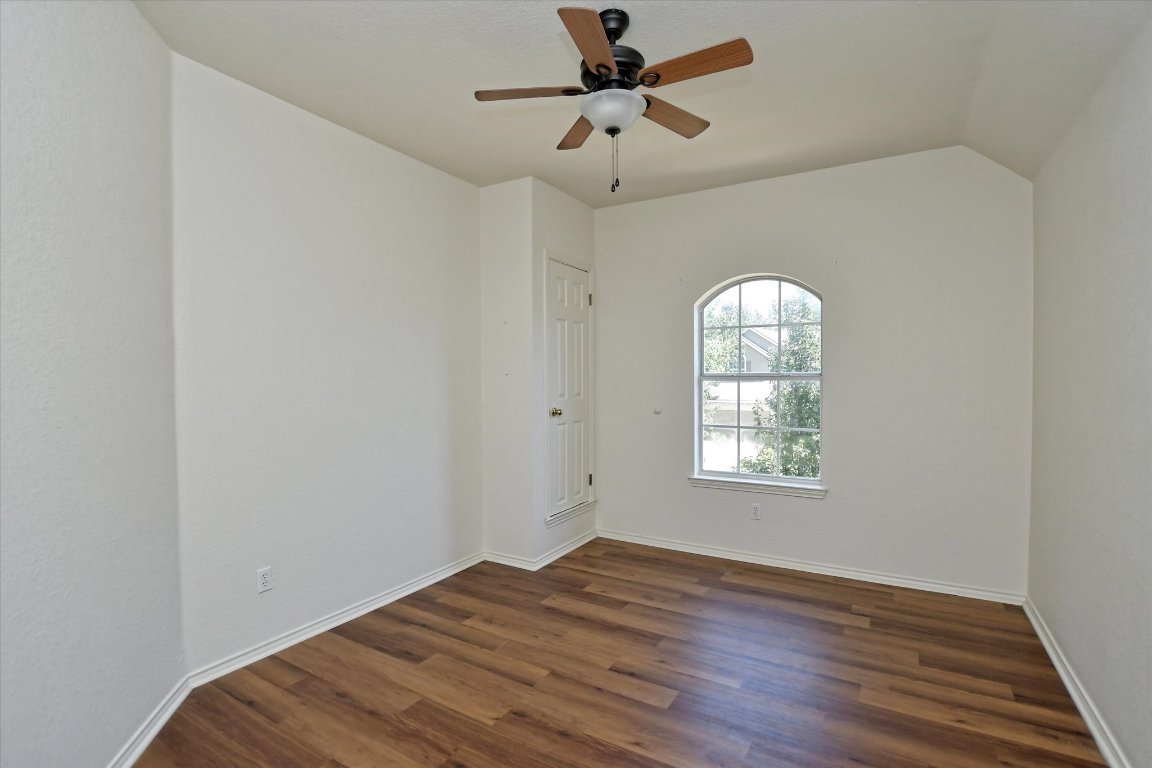 301 Gulfstream Drive Georgetown, TX 78626 - Photo 26 of 35 a view of empty room with wooden floor and fan
