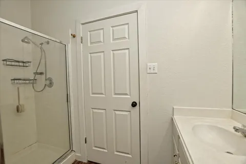 a bathroom with a tub and shower