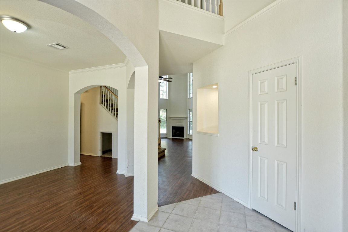 301 Gulfstream Drive Georgetown, TX 78626 - Photo 4 of 35 wooden floor in a hall with a gallery