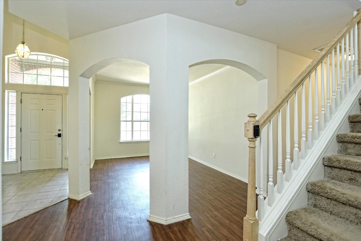 301 Gulfstream Drive Georgetown, TX 78626 - Photo 5 of 35 a view of a hallway with wooden floor and staircase