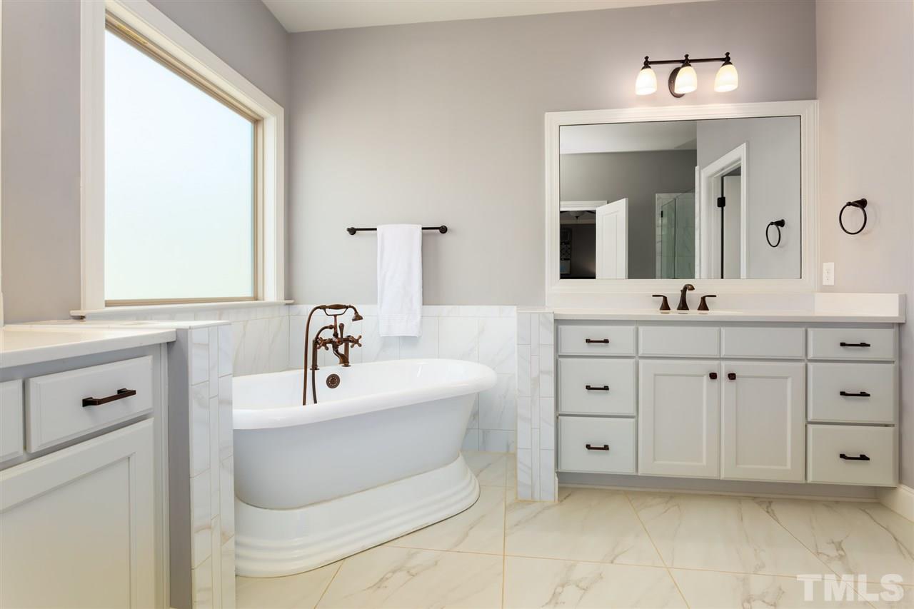101 Pineland Circle Raleigh, NC 27606 - Photo 11 of 21 a bathroom with a sink double vanity and a mirror