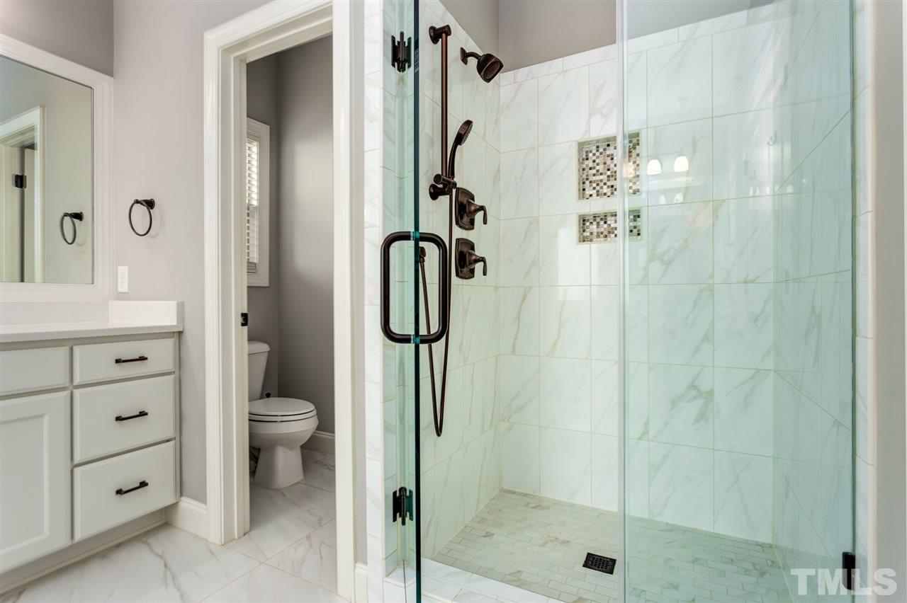 101 Pineland Circle Raleigh, NC 27606 - Photo 12 of 21 a bathroom with a shower toilet and sink