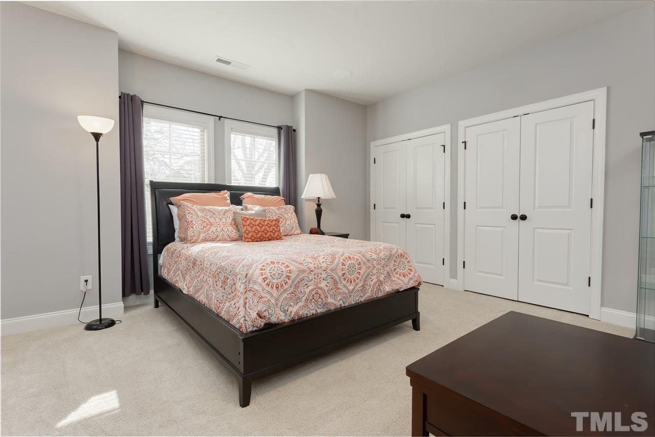 101 Pineland Circle Raleigh, NC 27606 - Photo 14 of 21 a bedroom with a bed and window