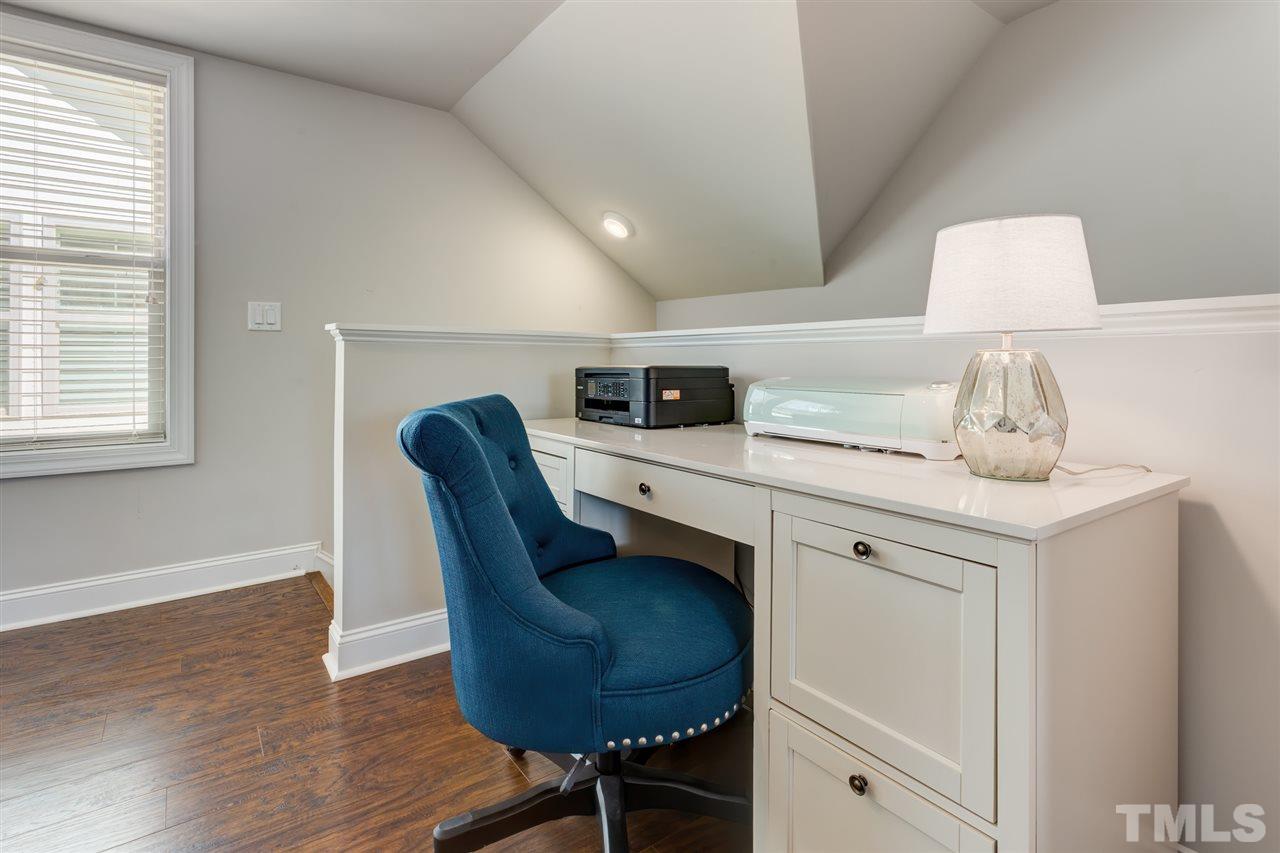 101 Pineland Circle Raleigh, NC 27606 - Photo 17 of 21 a kitchen with stainless steel appliances granite countertop a sink a stove and a wooden floors