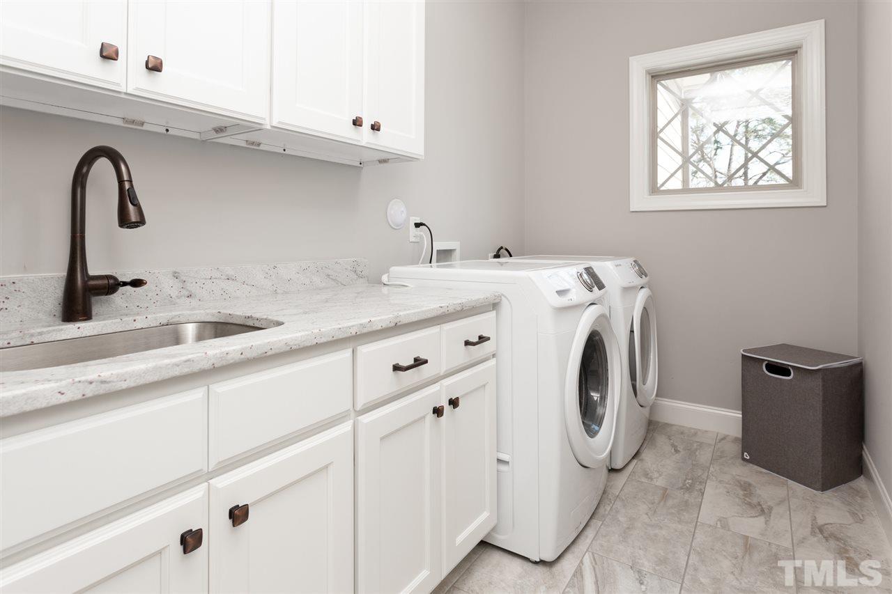 101 Pineland Circle Raleigh, NC 27606 - Photo 19 of 21 a utility room with sink dryer and washer