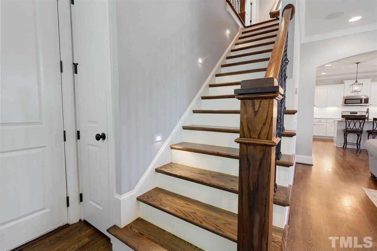 101 Pineland Circle Raleigh, NC 27606 - Photo 9 of 21 a view of entryway and hall with wooden floor