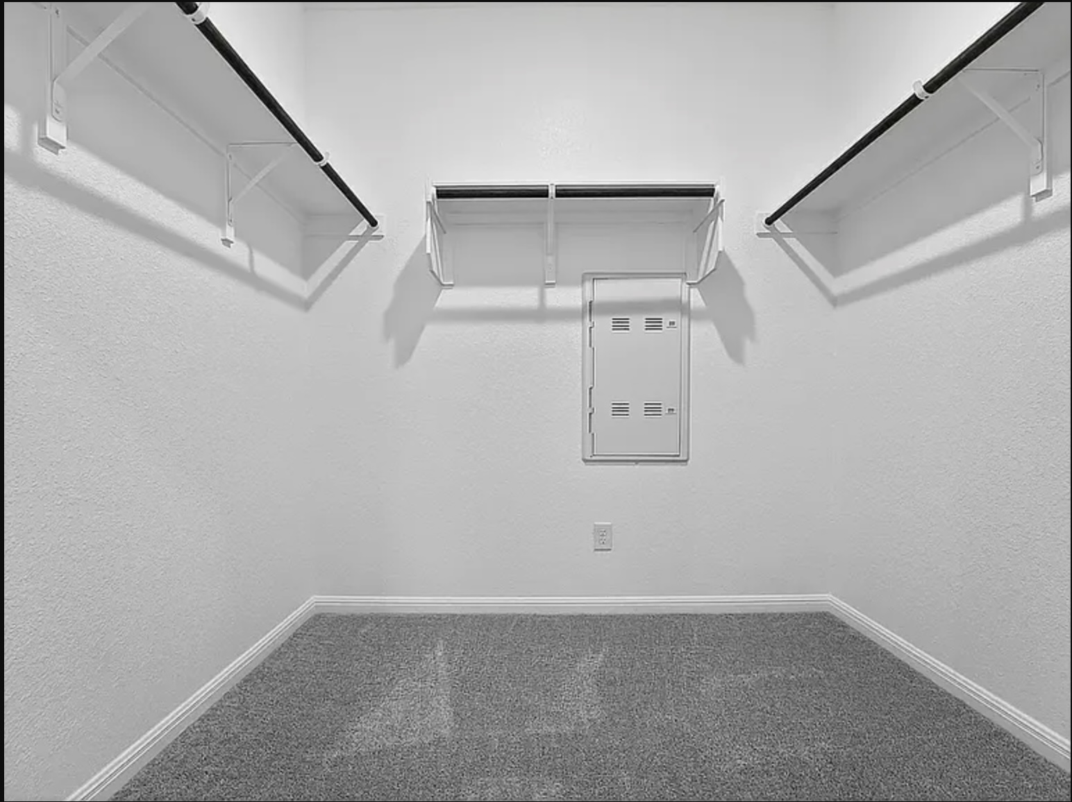 203 Betsy Road Hutto, TX 78634 - Photo 11 of 21 Ample built-in shelving and soft carpeting define this functional walk-in closet space.