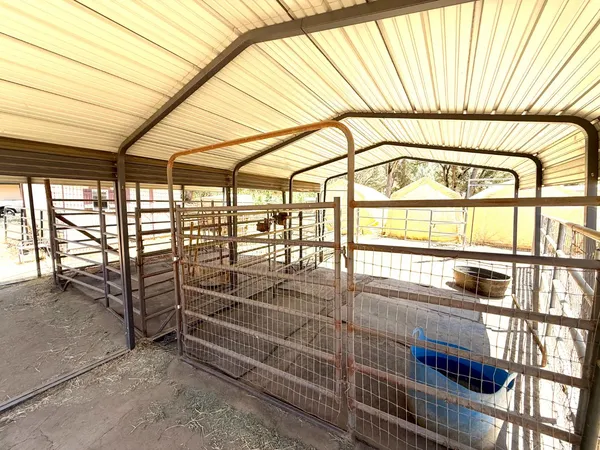 a balcony with view of outdoor space