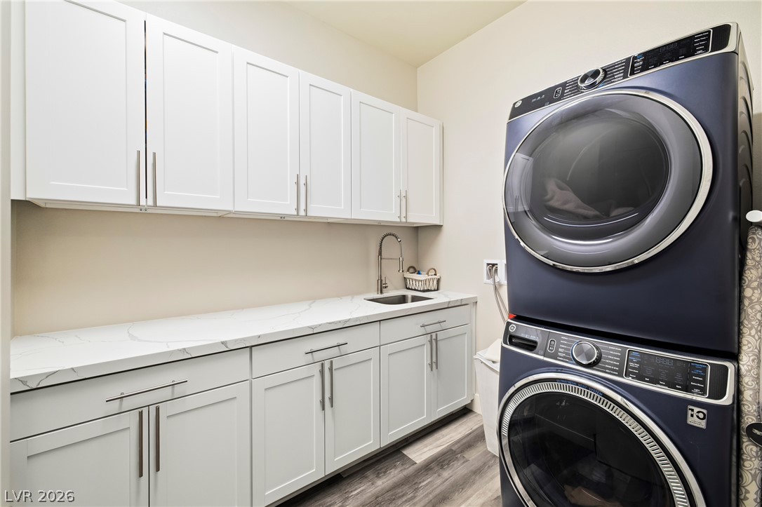 45 Garibaldi Way Henderson, NV 89011 - Photo 30 of 74 Organized laundry space offers ample counter space and convenient stacking appliances for effortless chores.