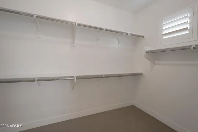 a view of an empty walk in closet