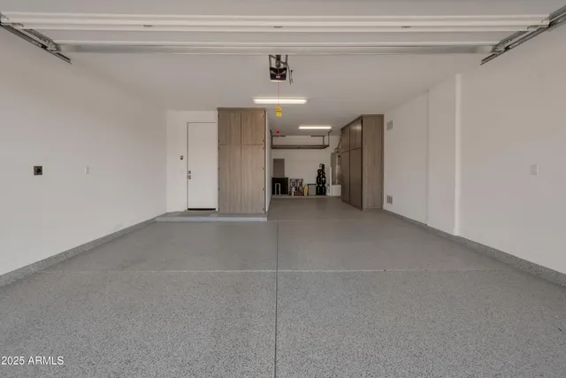 a front view of a house with a garden and yard