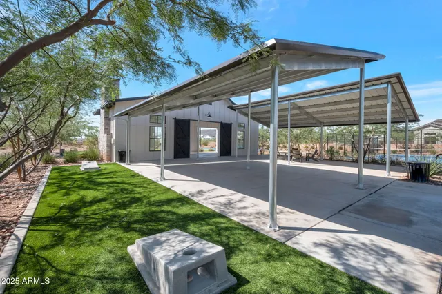 a view of a porch with a table and chairs