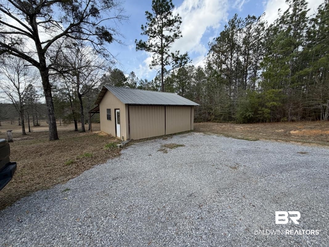 19225 Joan Harris Road Mount Vernon, AL 36560 - Photo 3 of 7 Garage with driveway