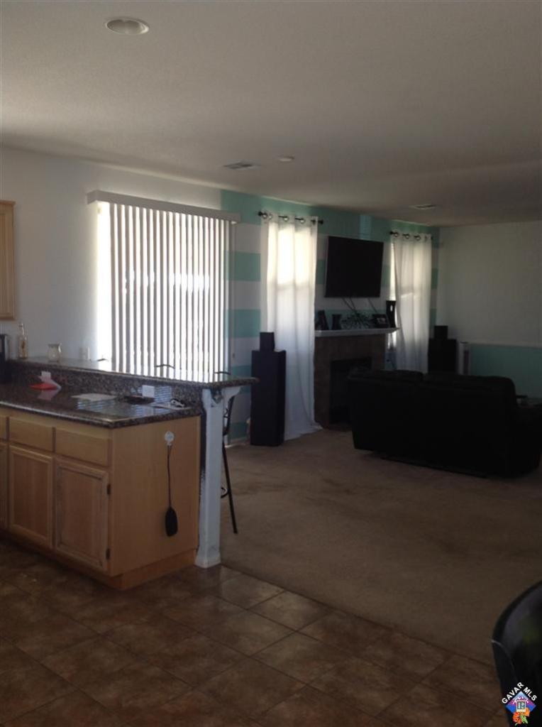 42909 Edson Avenue Lancaster, CA 93536 - Photo 13 of 14 a room with furniture and a window
