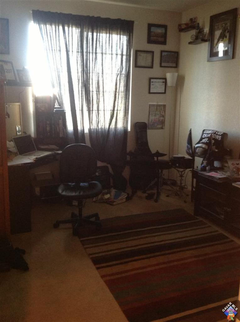 42909 Edson Avenue Lancaster, CA 93536 - Photo 4 of 14 a living room with furniture and a window