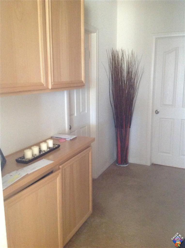 42909 Edson Avenue Lancaster, CA 93536 - Photo 5 of 14 a kitchen with granite countertop a sink a stove and a granite counter top