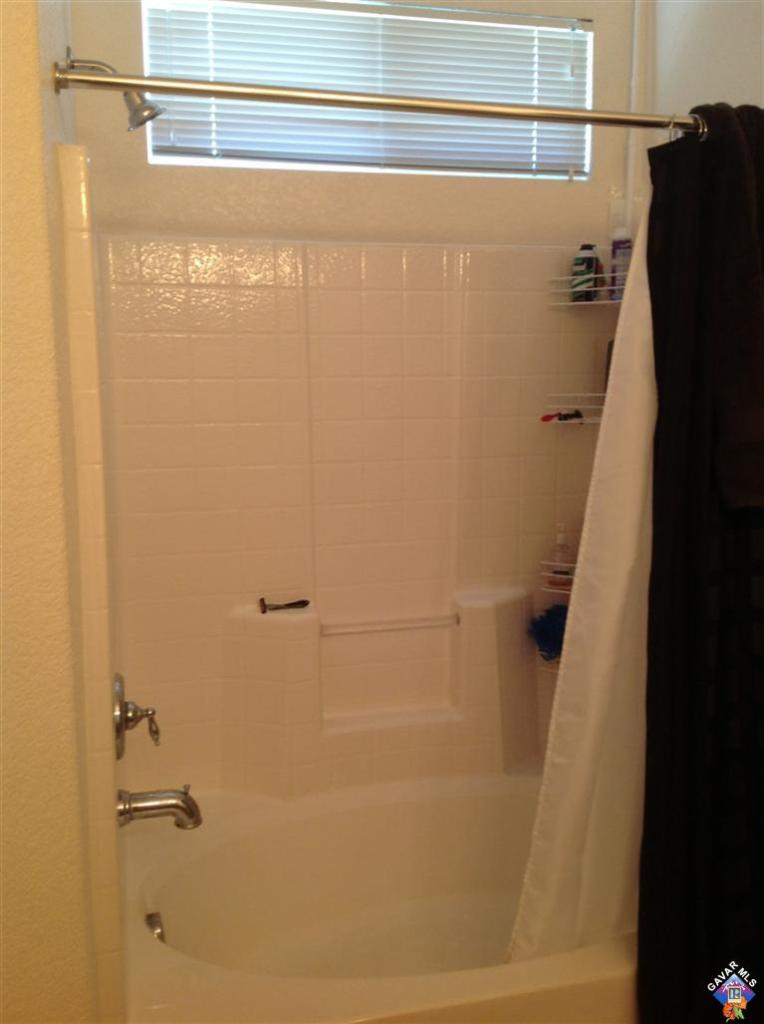 42909 Edson Avenue Lancaster, CA 93536 - Photo 9 of 14 a bathroom with a shower