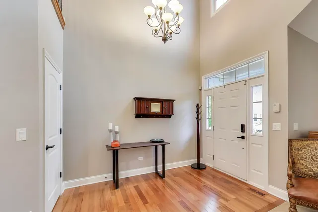 a view of a livingroom with wooden floor and a flat screen tv