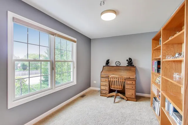 a livingroom with furniture and a window