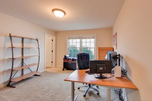 a workspace with furniture and window