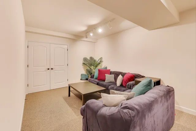 a living room with furniture and white walls