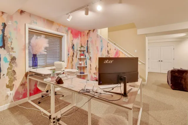 a work room with furniture and window