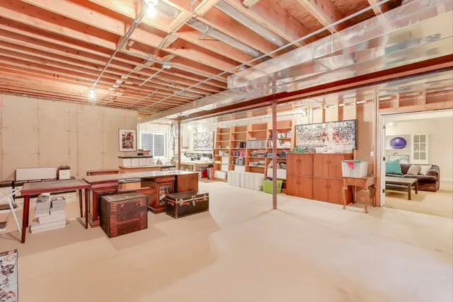a living room with lots of furniture and a chandelier
