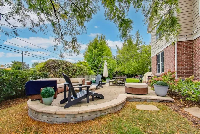 a view of a backyard with plants and patio