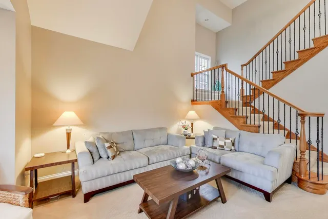 a living room with furniture and a table