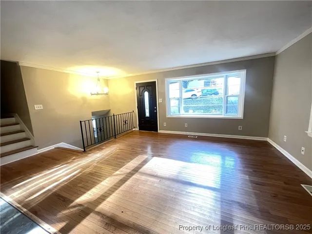 a view of a livingroom with wooden floor