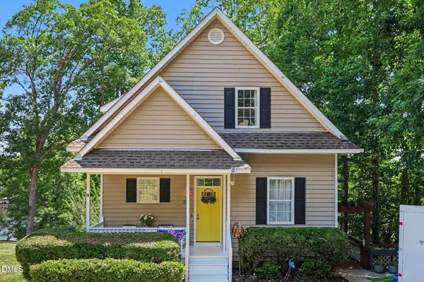 a front view of a house with yard