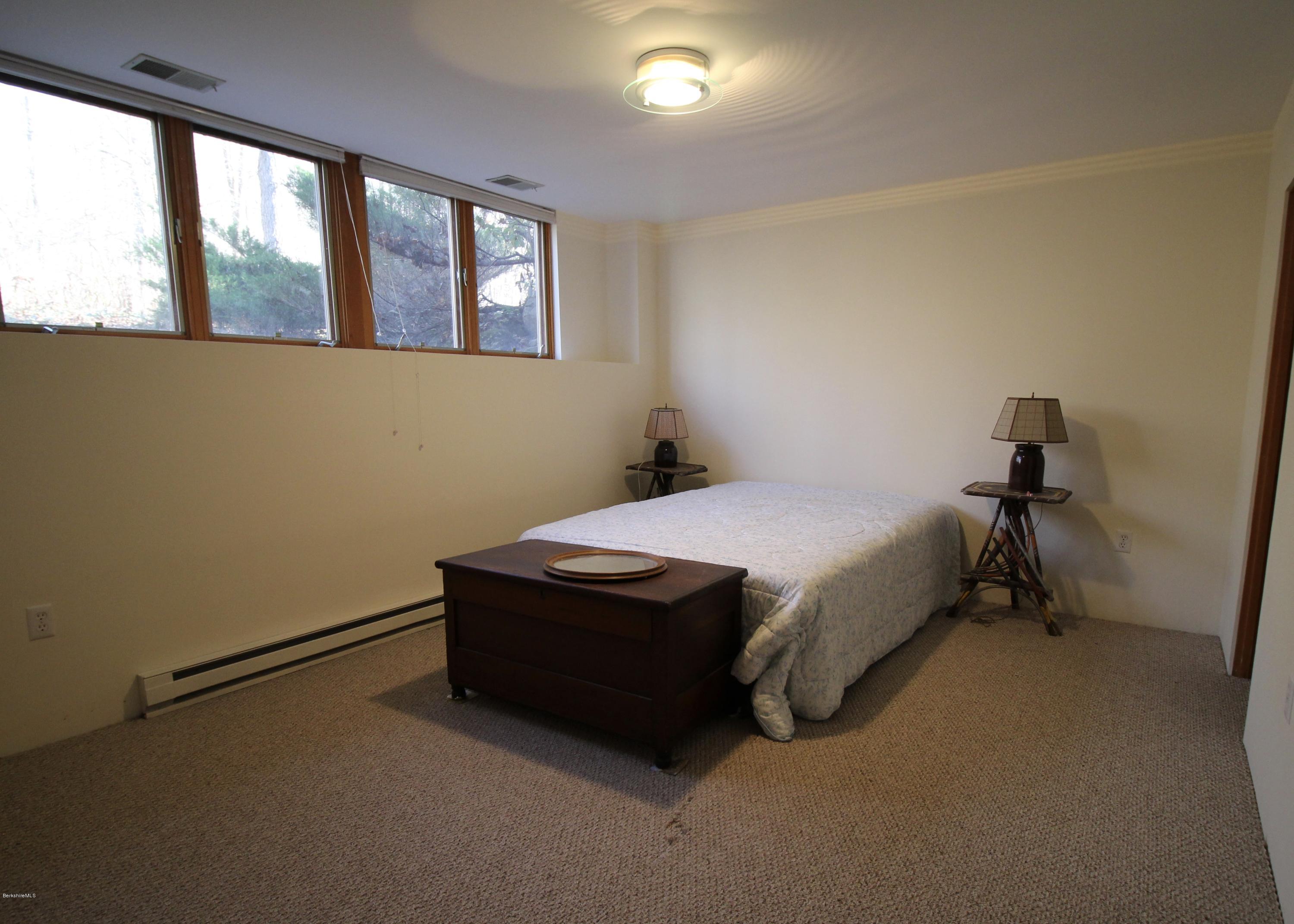 58 Maple Hill Road West Stockbridge, MA 01266 - Photo 17 of 21 a bed sitting in a room next to a window