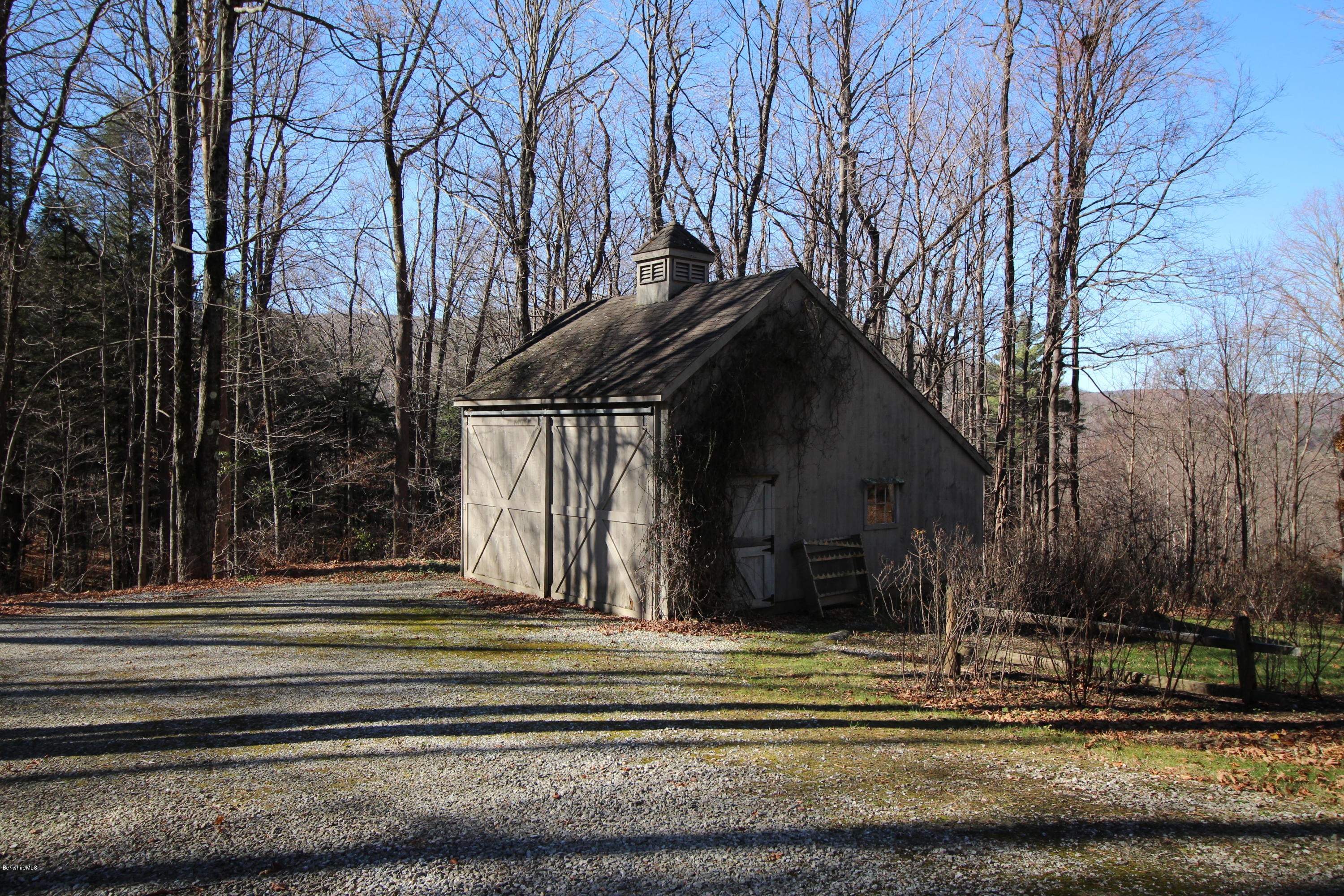 58 Maple Hill Road West Stockbridge, MA 01266 - Photo 21 of 21 a view of a house with a iron fence