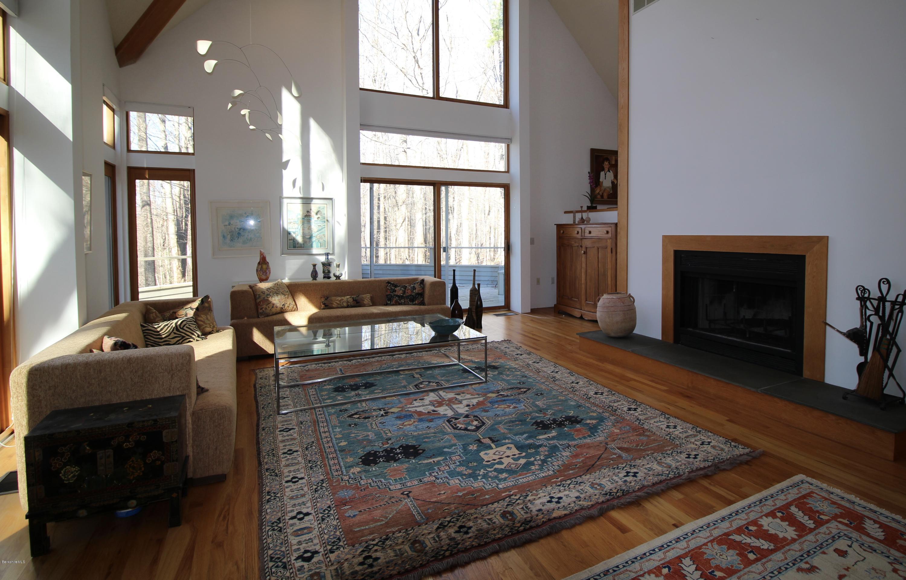 58 Maple Hill Road West Stockbridge, MA 01266 - Photo 9 of 21 a living room with furniture windows and a fireplace