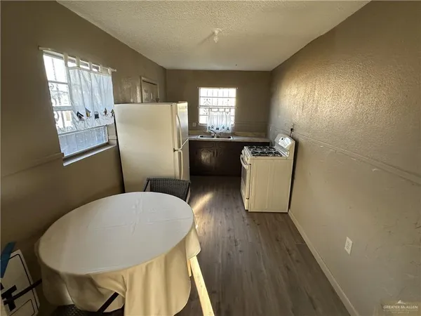 a view of a dining room with furniture and window