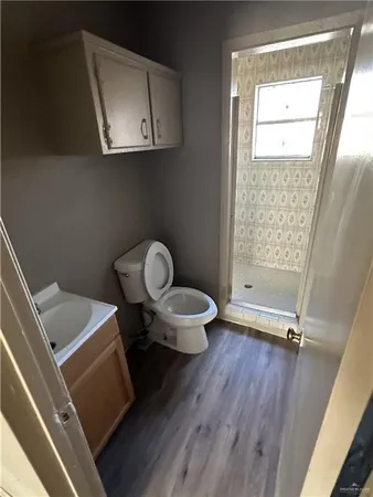 a bathroom with a toilet and a sink