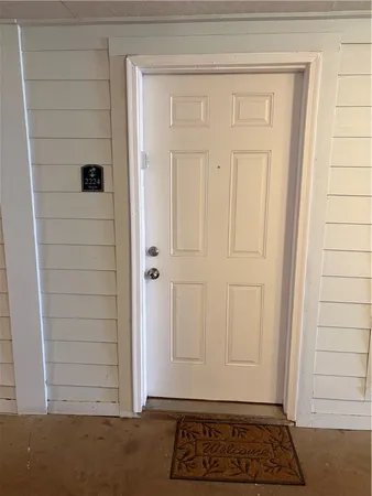 a view of a door and a window