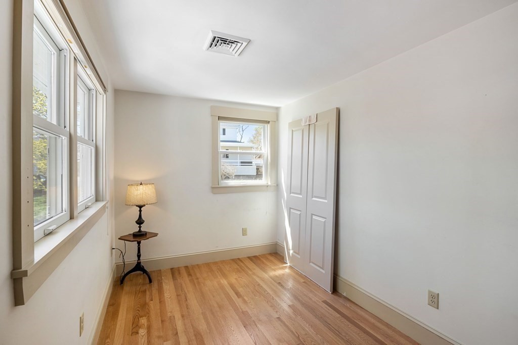 238 Nantasket Road Hull, MA 02045 - Photo 20 of 29 a view of a room with wooden floor and a window