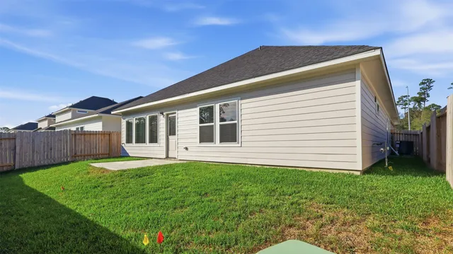 a front view of a house with a yard and porch