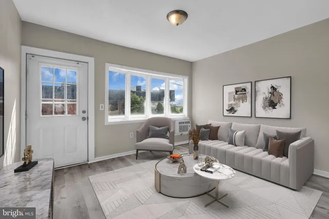 a living room with furniture and windows