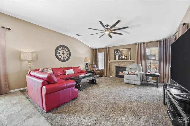 a kitchen with stainless steel appliances granite countertop a sink a stove a microwave and cabinets