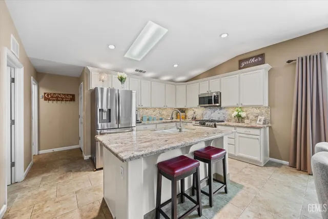 a bathroom with a sink a vanity and a mirror